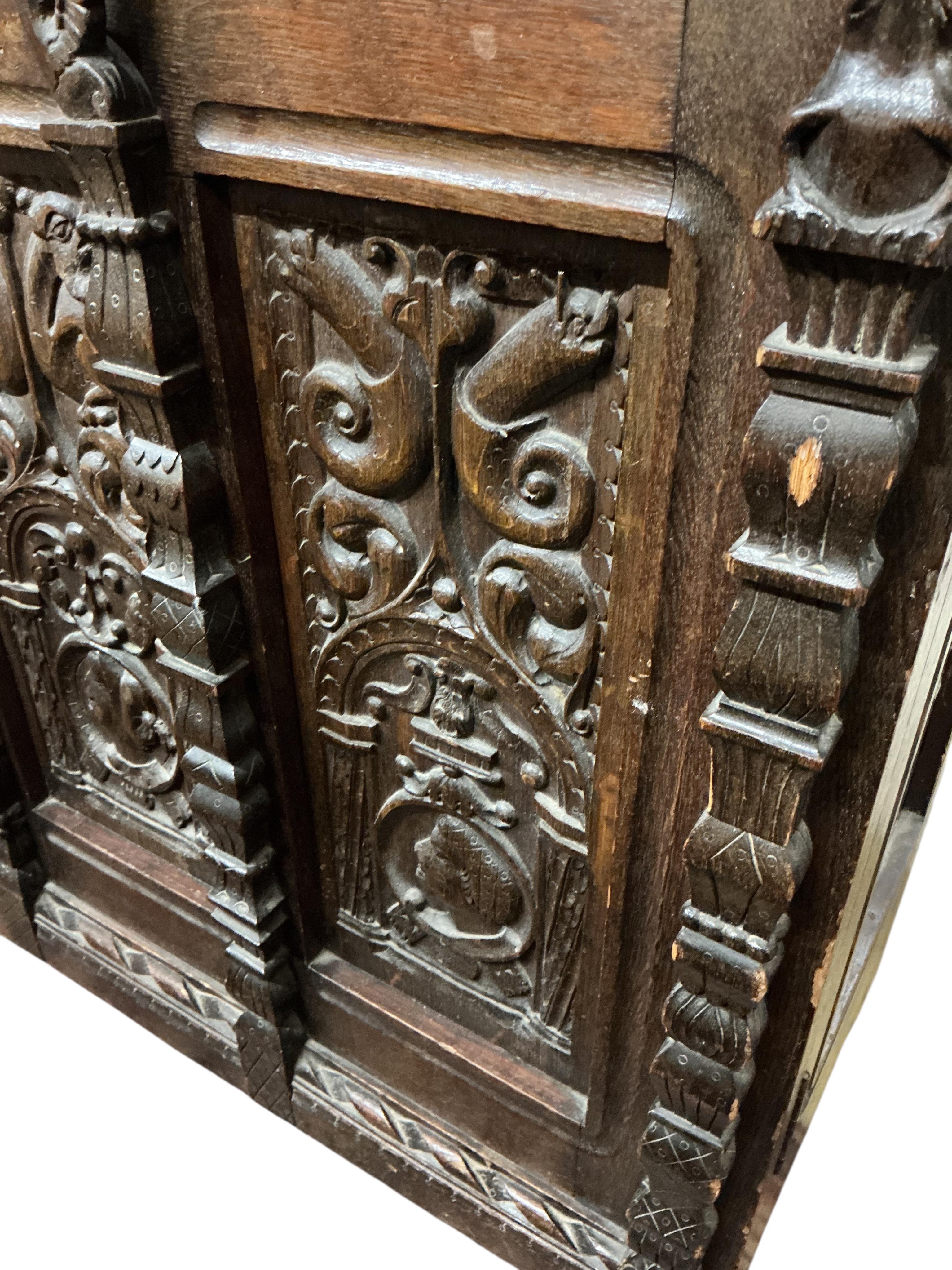 A 17th century style carved oak side coffer, width 145cm, depth 47cm, height 86cm